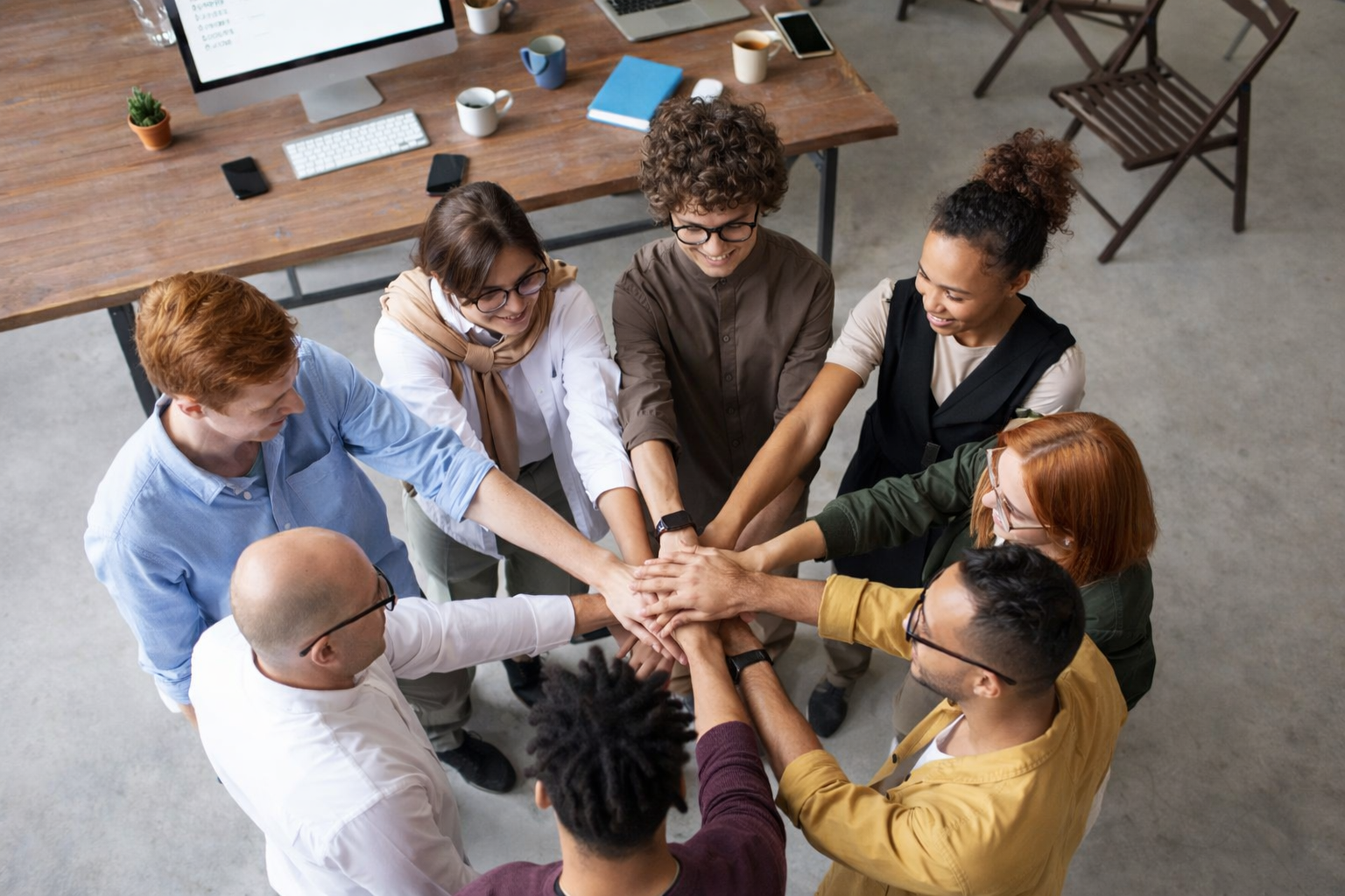 photo of people holding each other s hands